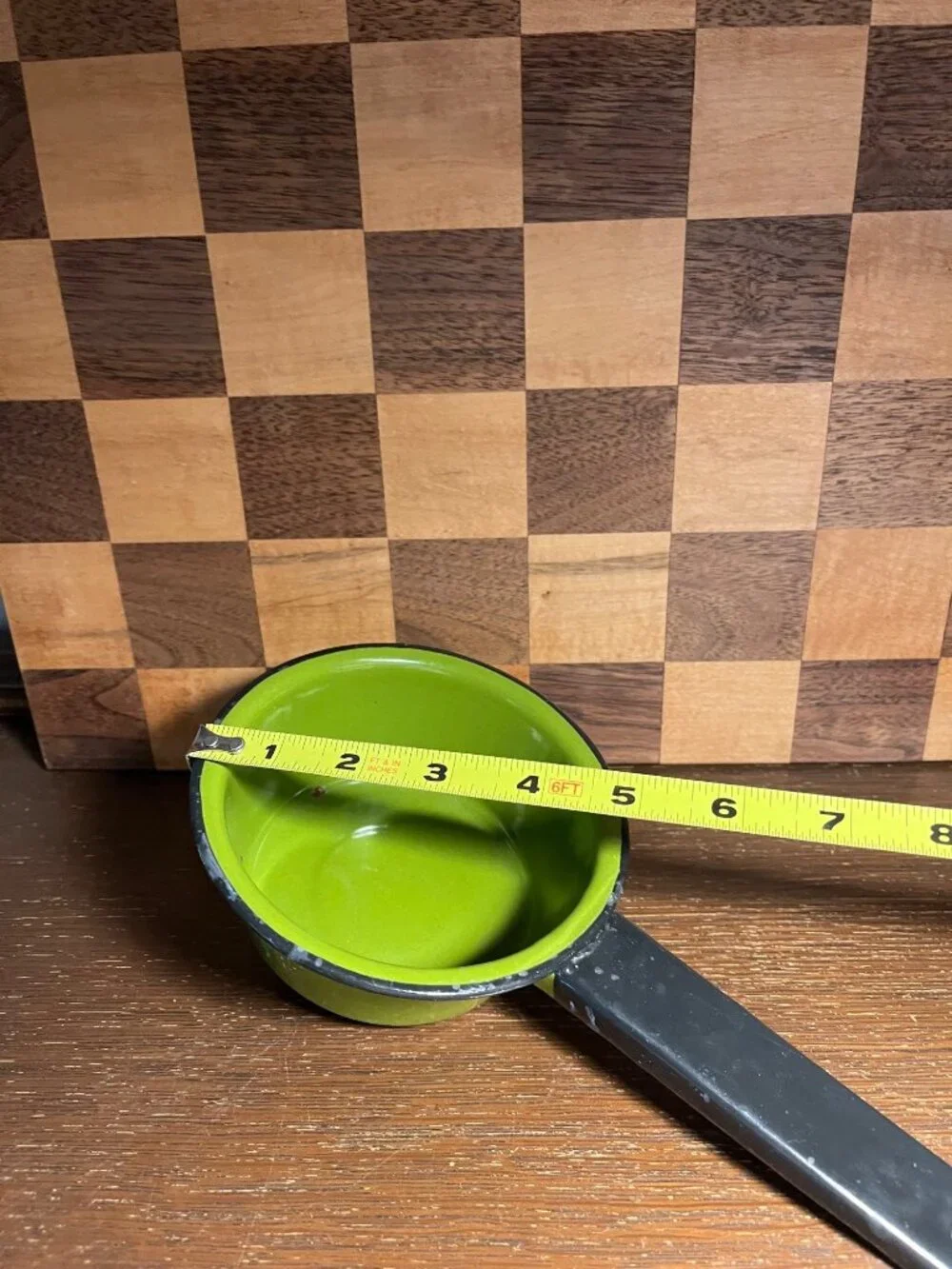 Vintage Small Avocado Green Enamel Pan with Black Handle, shows wear